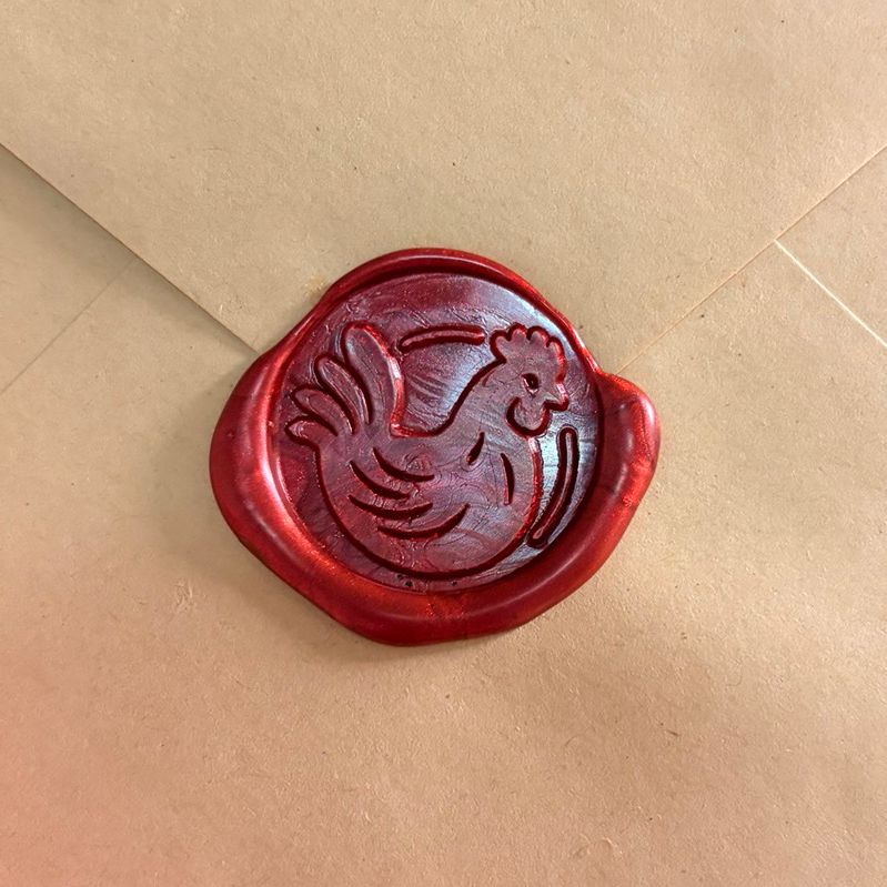 Red Hen crimson wax seal on kraft envelope